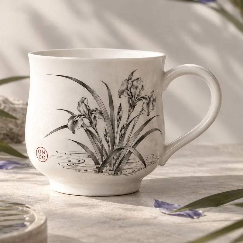 Ondo summer cup with iris leaves and a bloom drawn in black ink and a red ON/DO seal